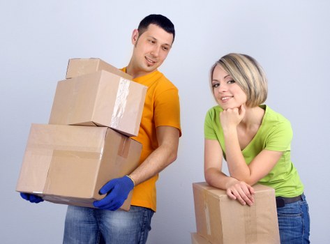 Movers navigating stairs during a Greenford apartment relocation